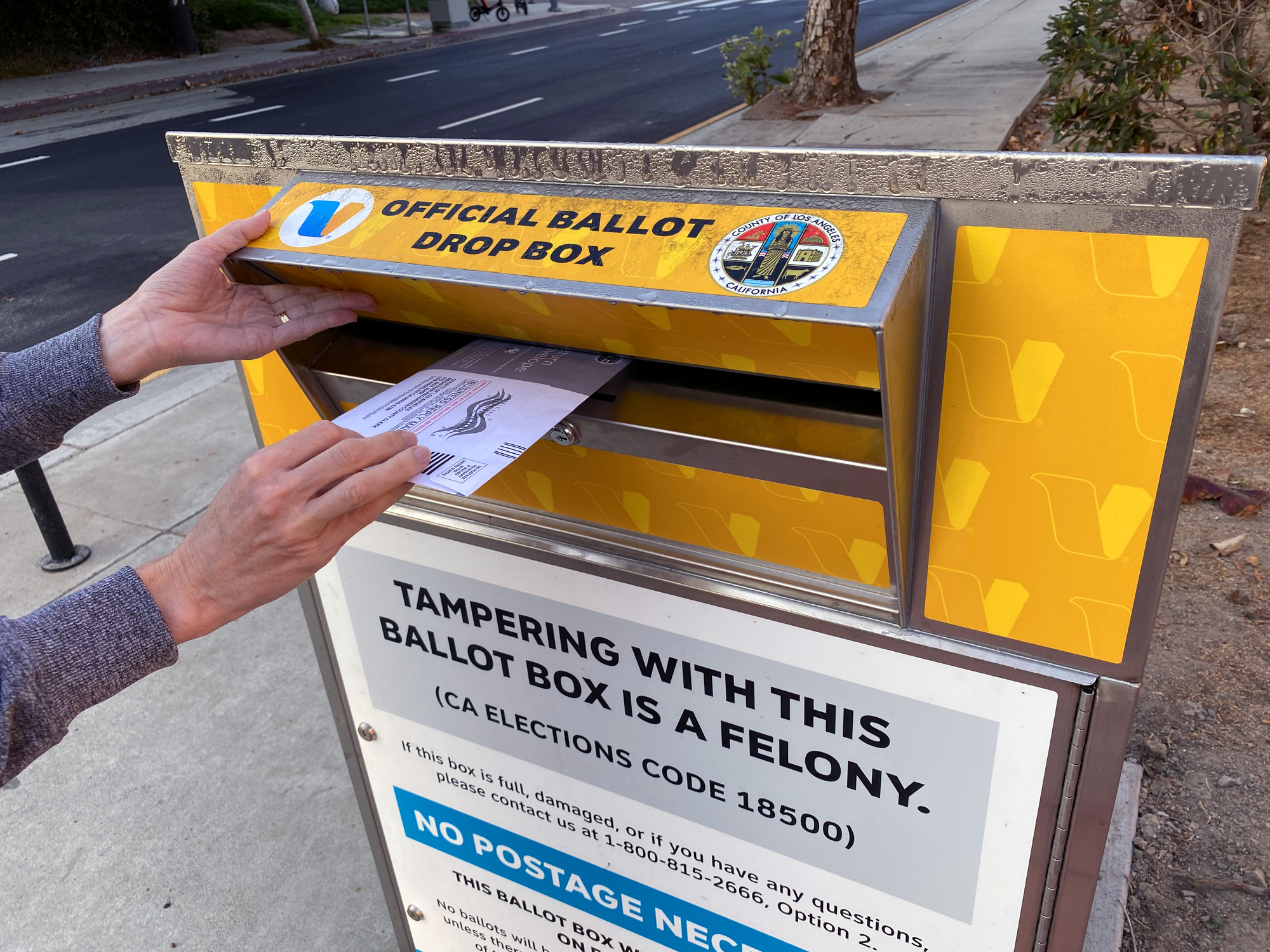 Venice, CA, USA - October 12, 2020: Placing 2020 ballot in official drop box